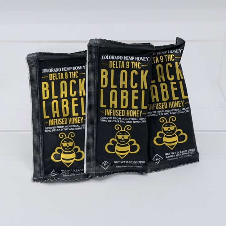 Black Label Delta 9 THC individual honey packet with 10mg Delta 9 THC and 10mg CBD each